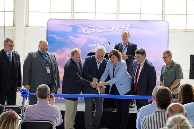 people cutting ribbon